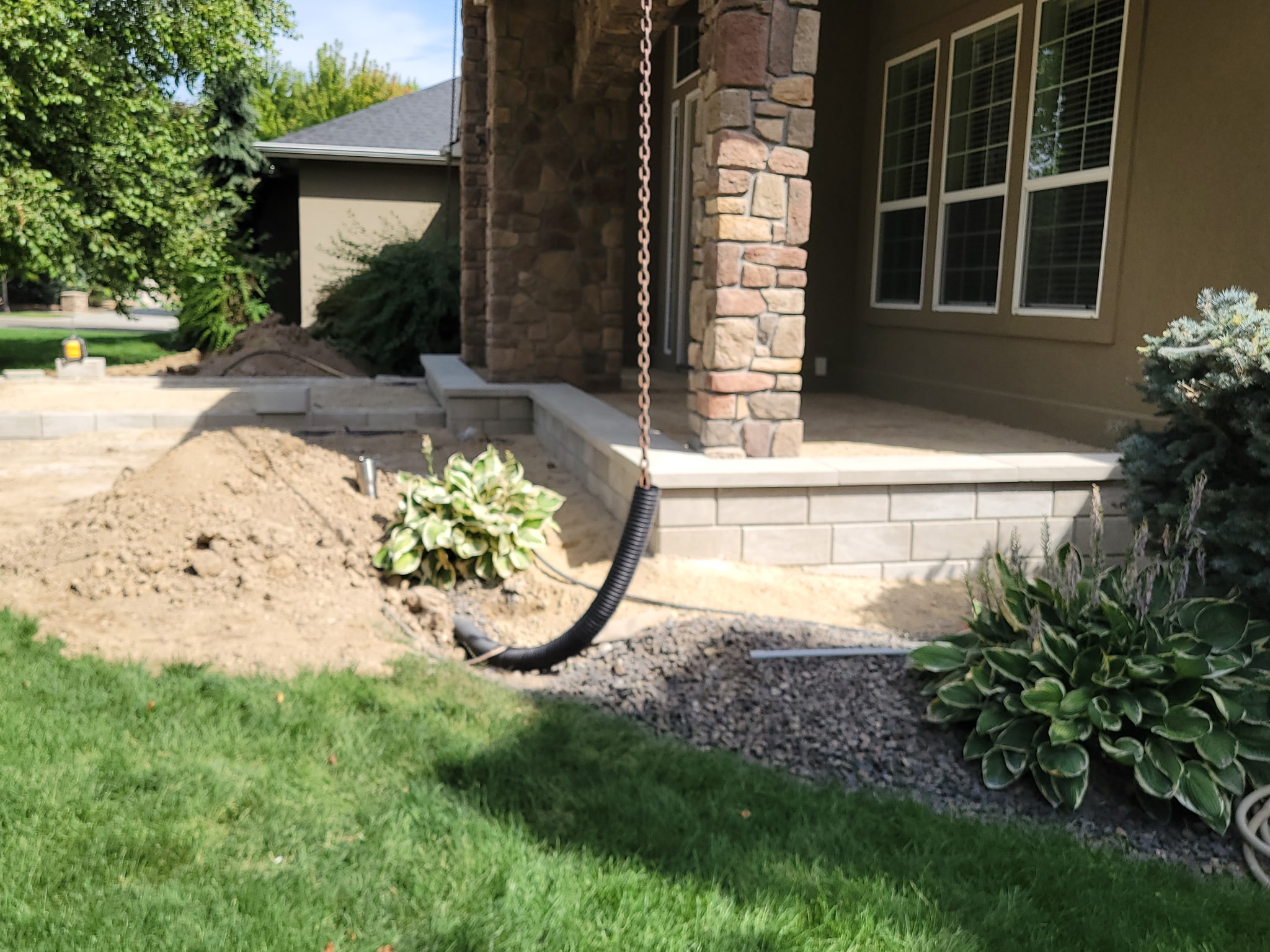 Lynch Brothers landscape sitework in progress beside an Idaho home